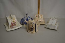 Group of four vintage cheese dishes and a further teapot