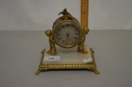 Small 20th Century French brass and marble based mantel clock with cherub mounts