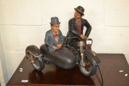 Laurel & Hardy figures on a motorbike and sidecar