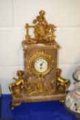 20th Century continental style marble cased mantel clock with metal figural mounts, quartz movement