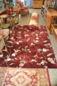 Red ground and floral decorated modern rug