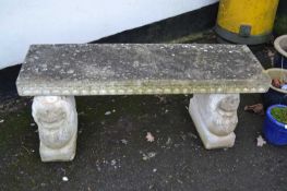 Concrete twin pedestal garden seat, the base formed as lions, 120cm wide