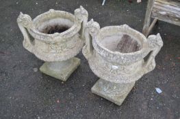 Pair of concrete urns with pedestal bases, 56cm high