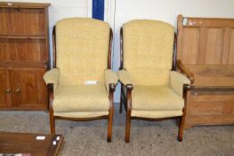 A pair of modern button back armchairs