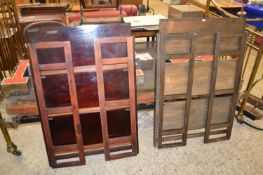 A pair of folding bookcases