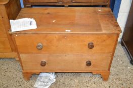 A small pine two drawer chest