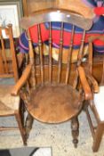 An elm seated stick back chair
