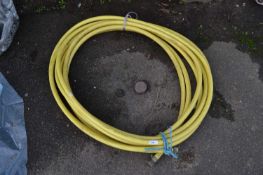 Roll of Trico Flex yellow hose piping