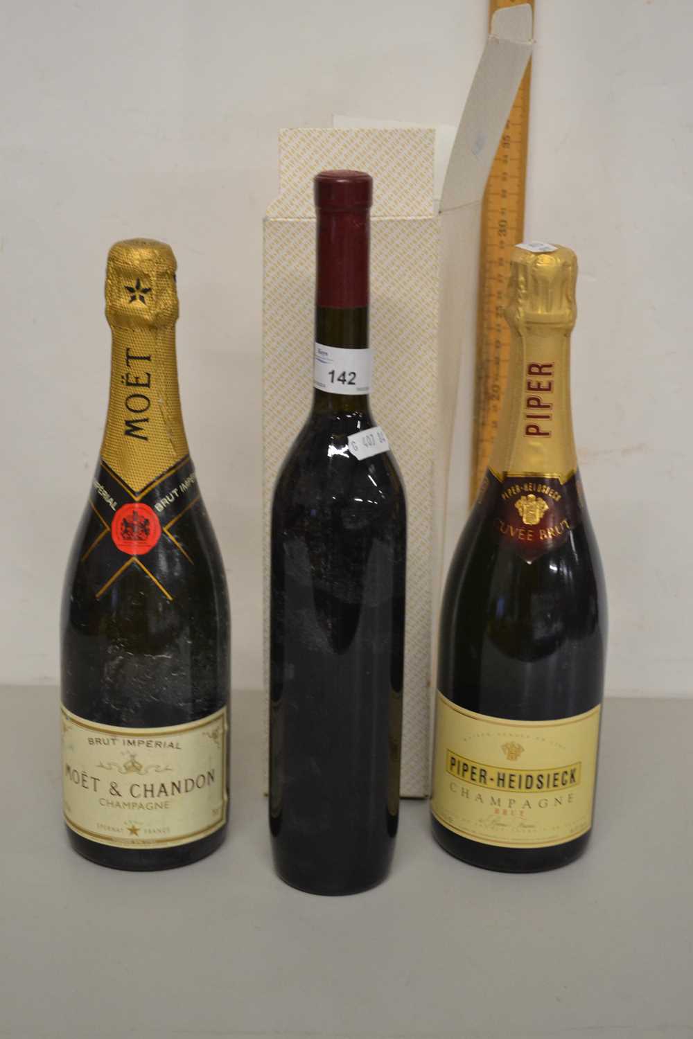 Mixed Lot: Two bottles of Champagne and a further unlabelled bottle of wine
