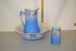 Bird decorated wash bowl and jug plus a further smaller jug