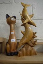 Carved wooden figure of dolphins and another of a cat