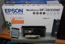 An Epsom Workforce WF-2820DWF printer, boxed