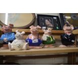 Five Nat West piggy bank pigs