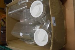 Quantity of glass jugs with lids