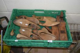 Box of various wooden shoe stretchers, woodworking planes etc