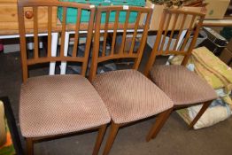 Three upholstered dining chairs