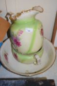 A green and floral glazed wash basin jug and chamber pot