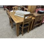 Modern extending oak dining table and four chairs