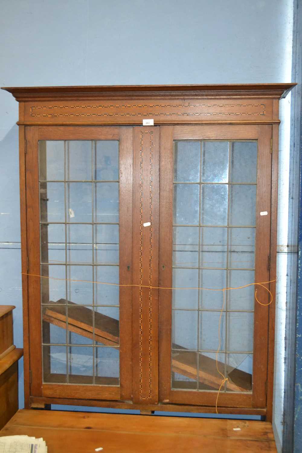 Late 19th or early 20th Century oak bookcase cabinet with lead glazed doors, damage to glass