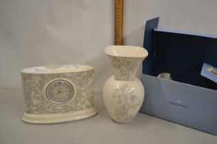 Wedgwood Interiors mantel clock together with an accompanying vase