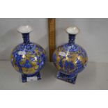 A pair of Foley ware pedestal vases with Chinese type decoration (one repaired)