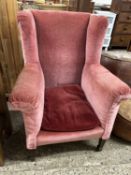 An early 20th Century wing back armchair