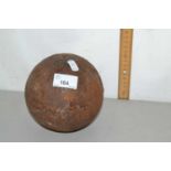 Cast iron ball, possibly a cannon ball or from a ball and chain, unmarked with small slightly