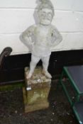 Weathered concrete garden gnome on associated plinth base