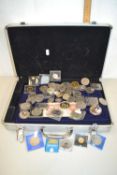 A coin collectors case containing a range of various British base metal royal commemorative issues