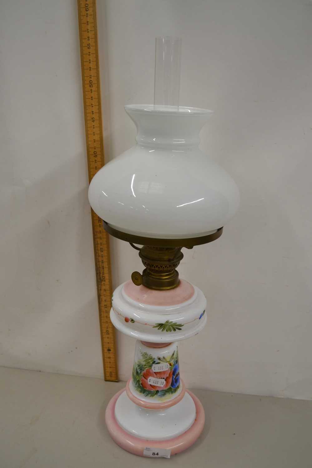 Oil lamp with a milk glass body with painted floral decoration
