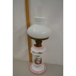 Oil lamp with a milk glass body with painted floral decoration