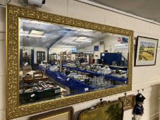 Large 20th Century rectangular bevelled wall mirror in gilt finish frame, 135cm wide