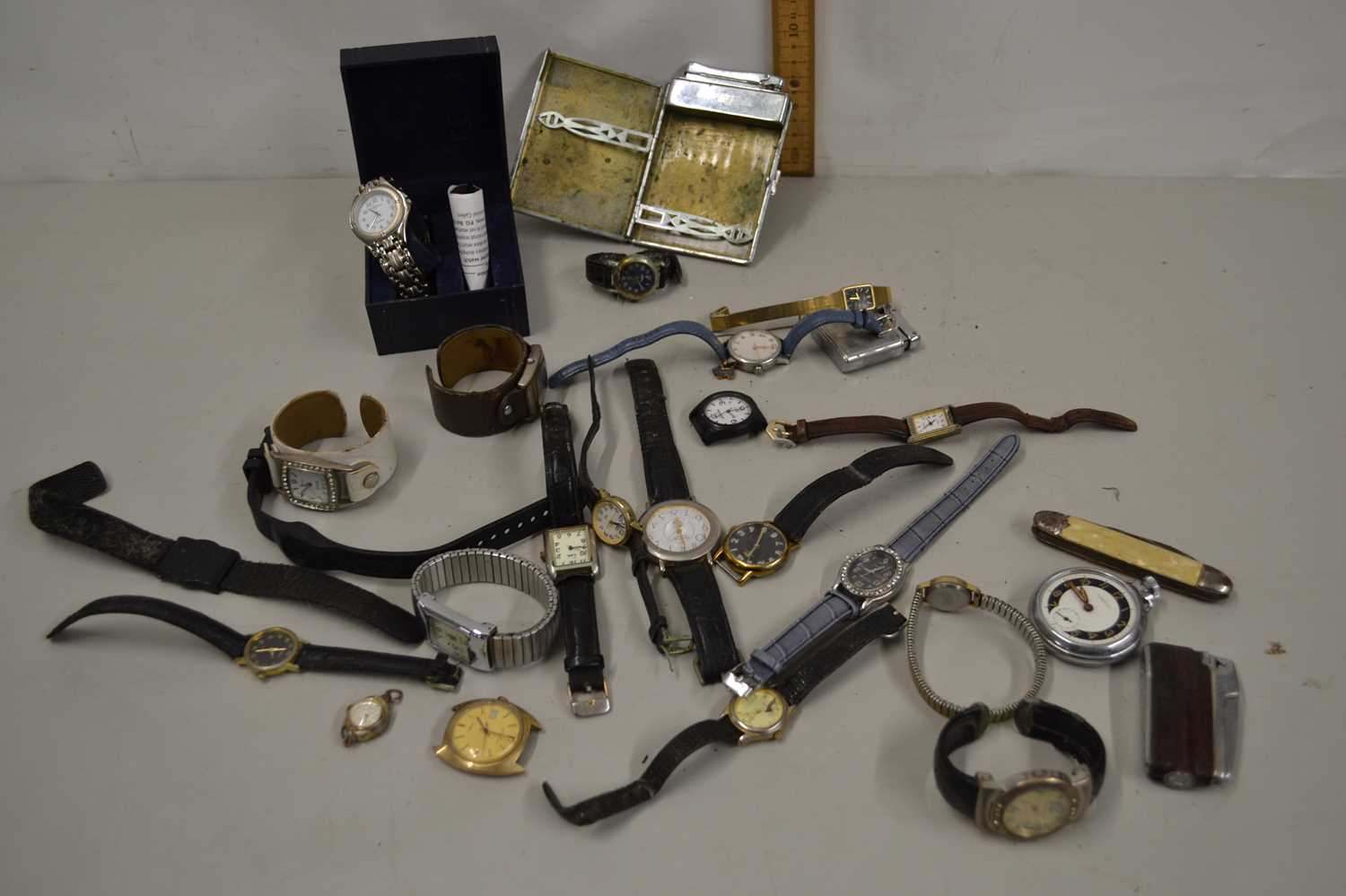 A basket of various assorted wristwatches