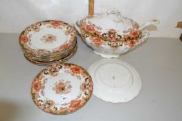 Gilt decorated soup tureen and accompanying plates