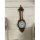 An early 20th Century oak cased barometer