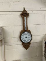 An early 20th Century oak cased barometer