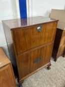 Early 20th Century mahogany drop front drinks cabinet with mirrored interior together with