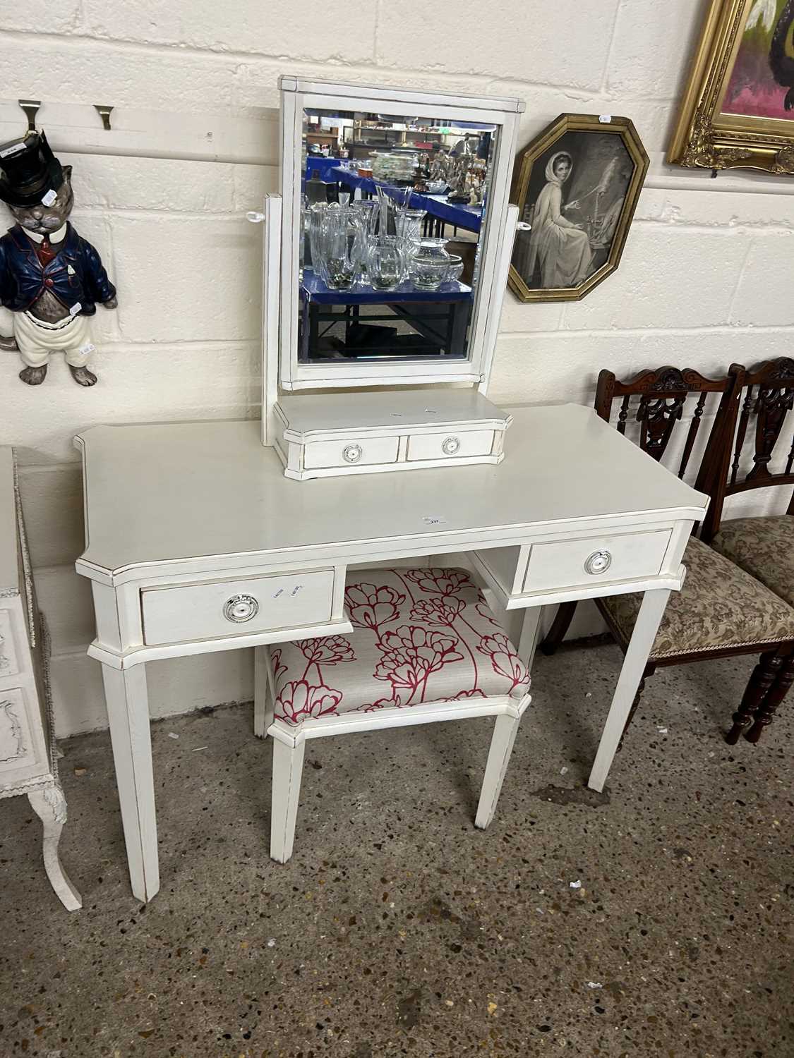 Modern white dressing table with accompanying stool and mirror