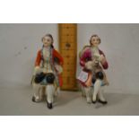 Pair of miniature continental porcelain seated figures