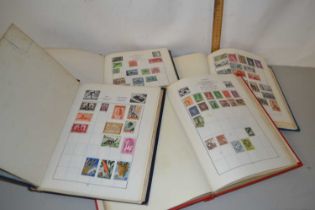 Four albums containing a junior world stamp collection