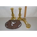 An iron pot stand together with pair of brass candlesticks and a poker stand (4)