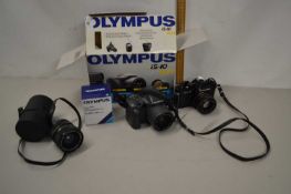 An Olympus IS-10 camera together with a Chinon CA-4 camera