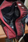 A pair of snowboarding boots and carry case