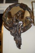 An Art Nouveau styled bronzed resin wall mirror