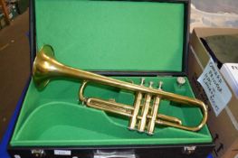 A trumpet, cased