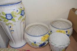 A large floral decorated vase together with a pair of similar plant pots and another (4)