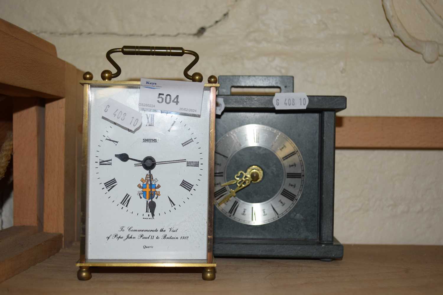Modern grey slate mantel clock and a commemorative carriage clock