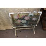 A floral decorated folding tray top table