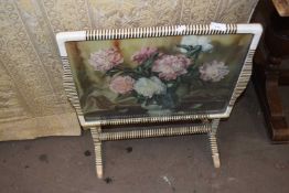 A floral decorated folding tray top table