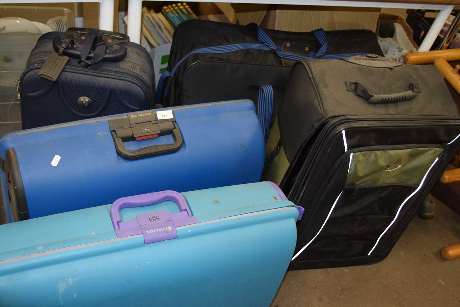 Five assorted suitcases